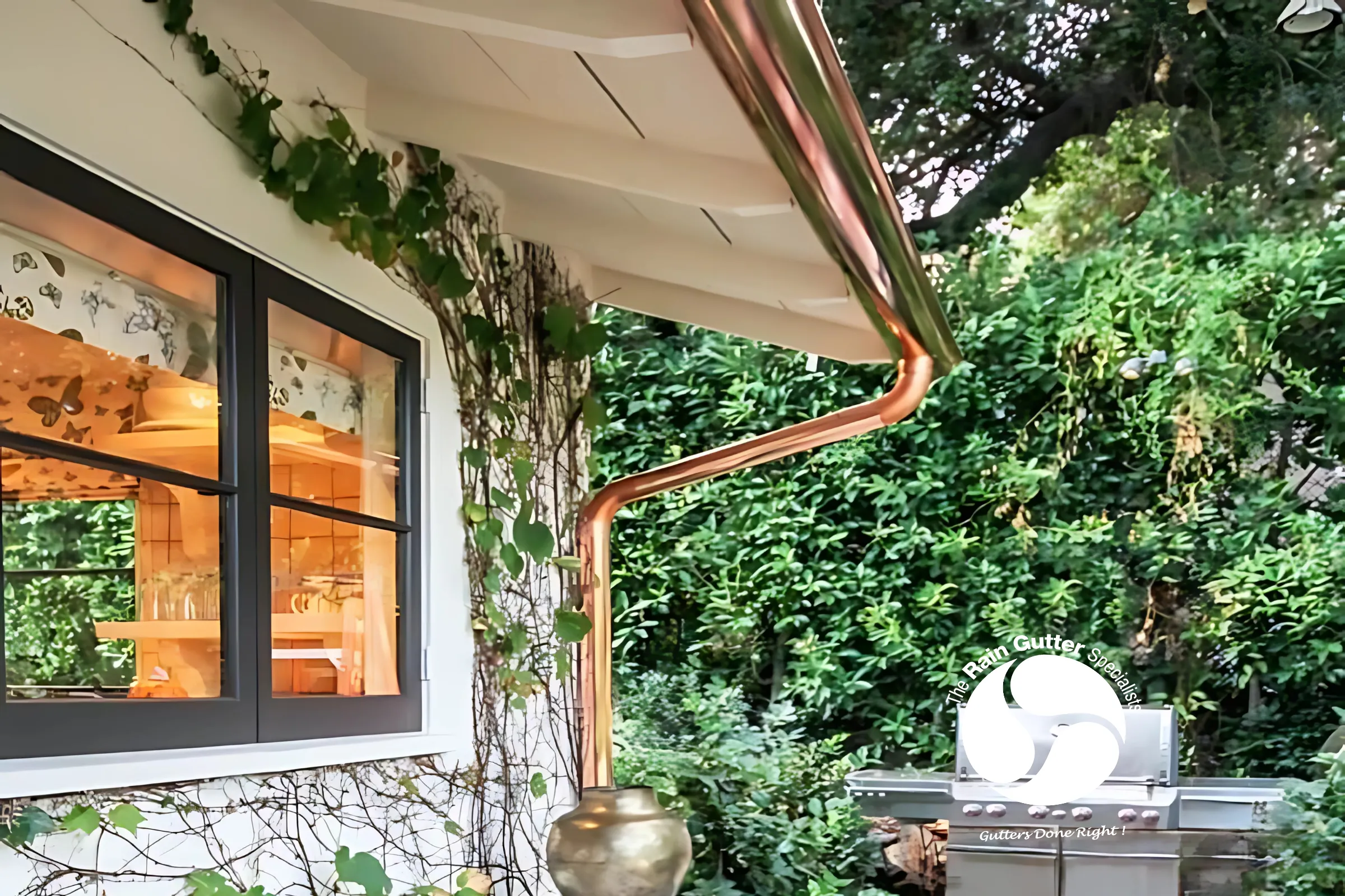 Half round gutters with copper finish by The Rain Gutter Specialists