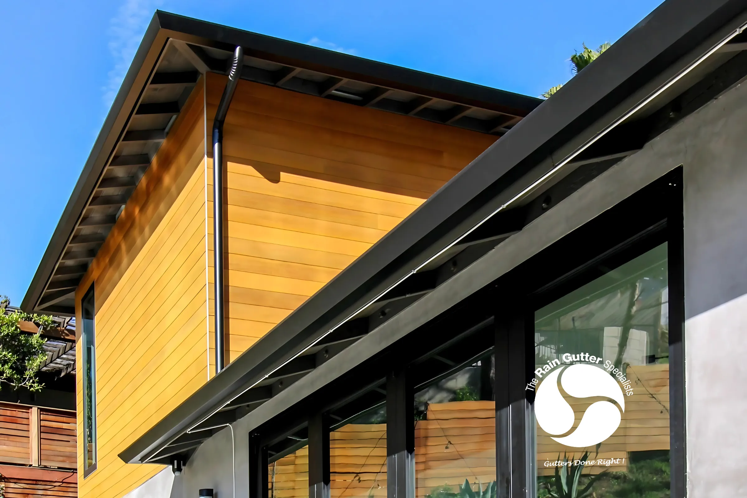 Angular view of gutter on a yellow modern home