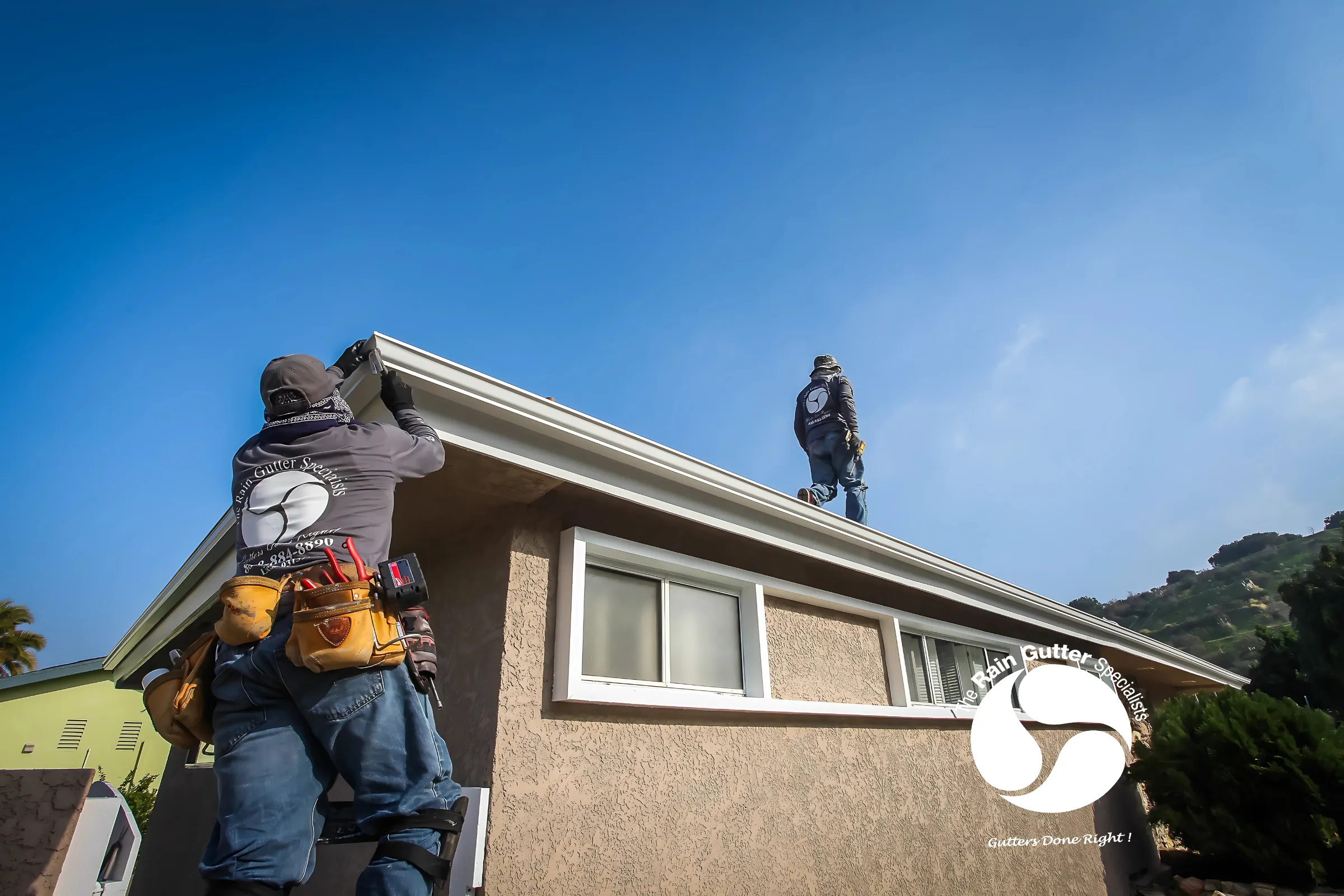 The Rain Gutter Specialists working together on-site 8