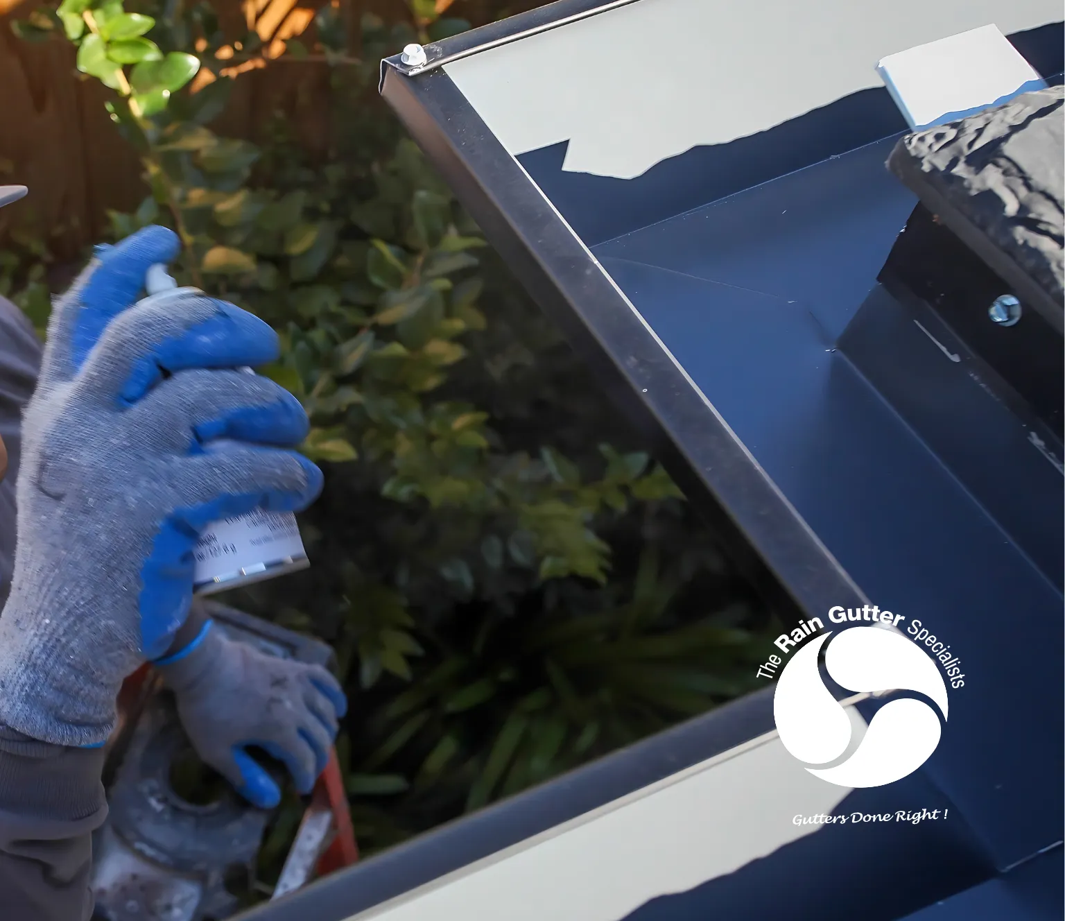 Technician installing gutters with selected custom color finish