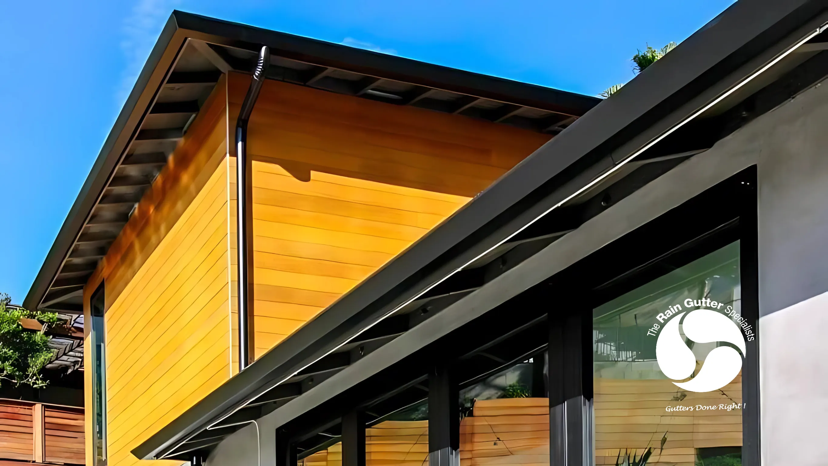 Modern home with new seamless rain gutter system installed.