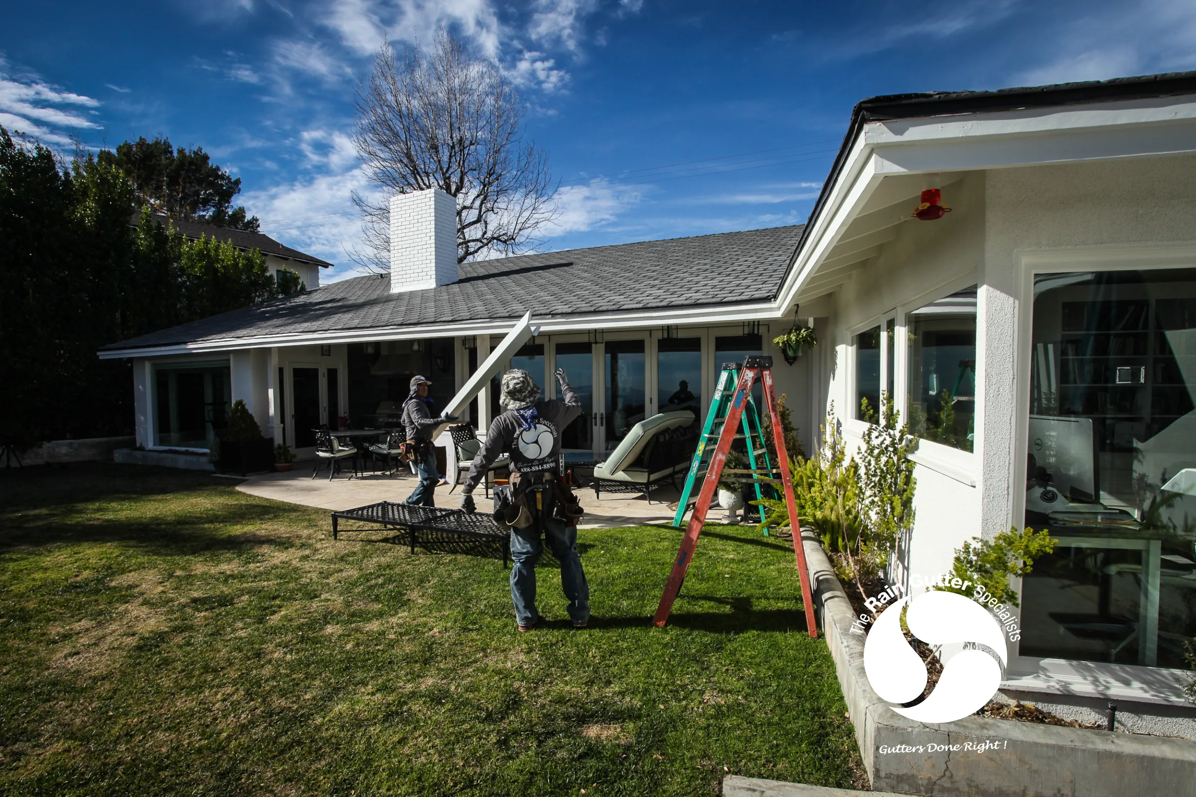 The Rain Gutter Specialists installing gutters on-site 2
