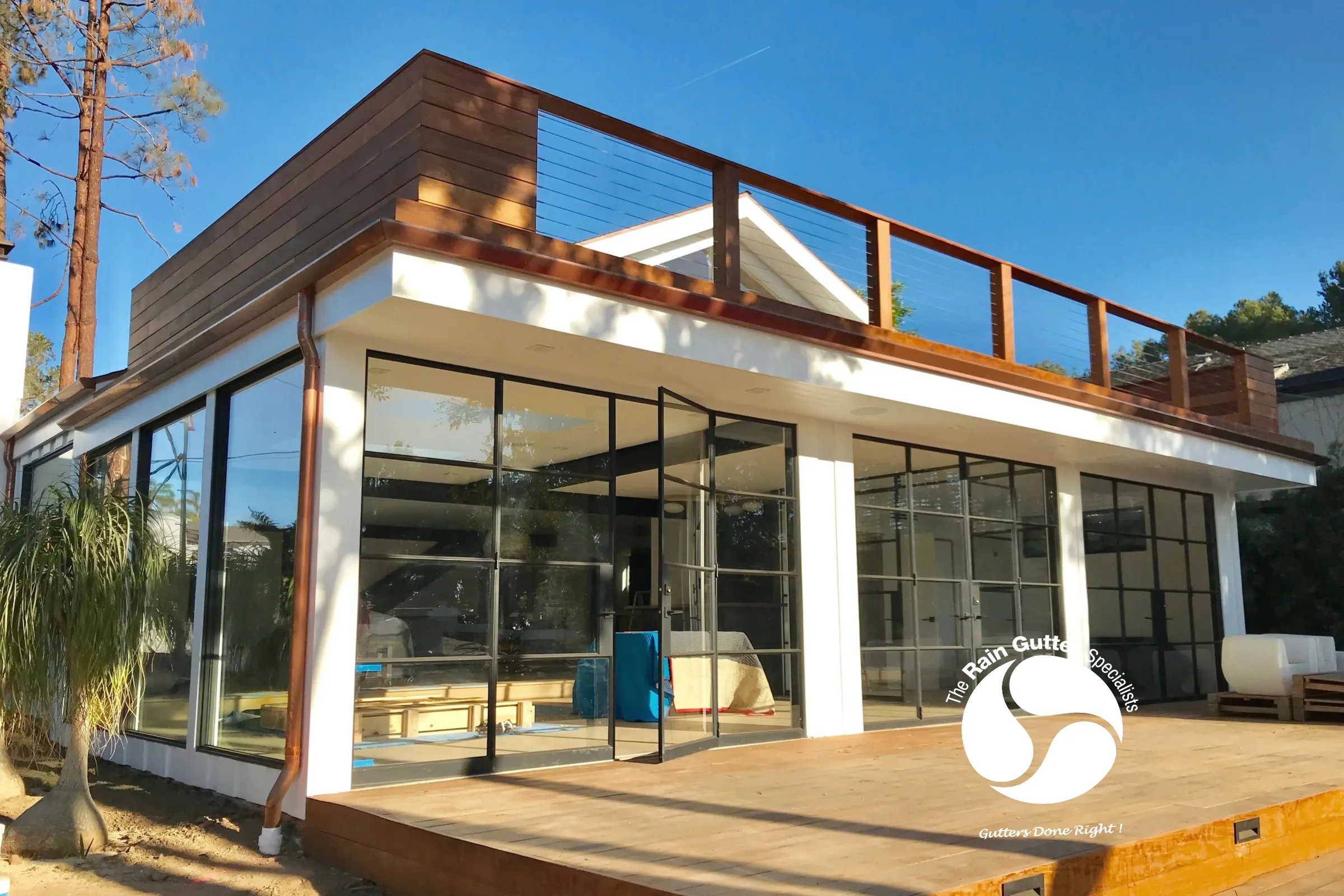 Coastal deck view with copper gutter accents