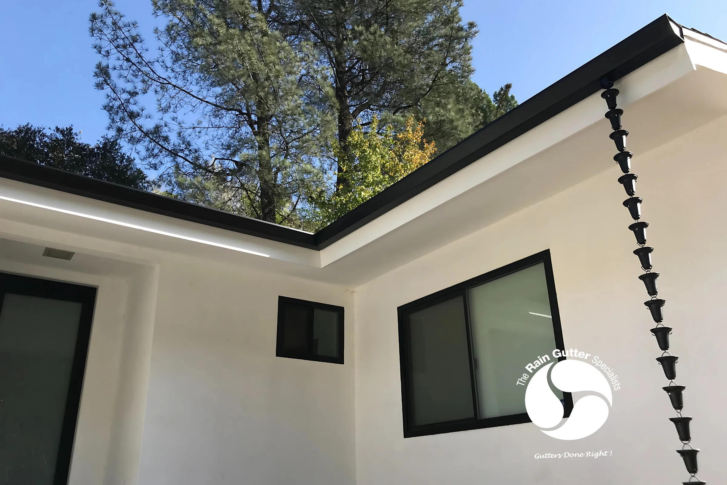 Garage view with modern black downspout