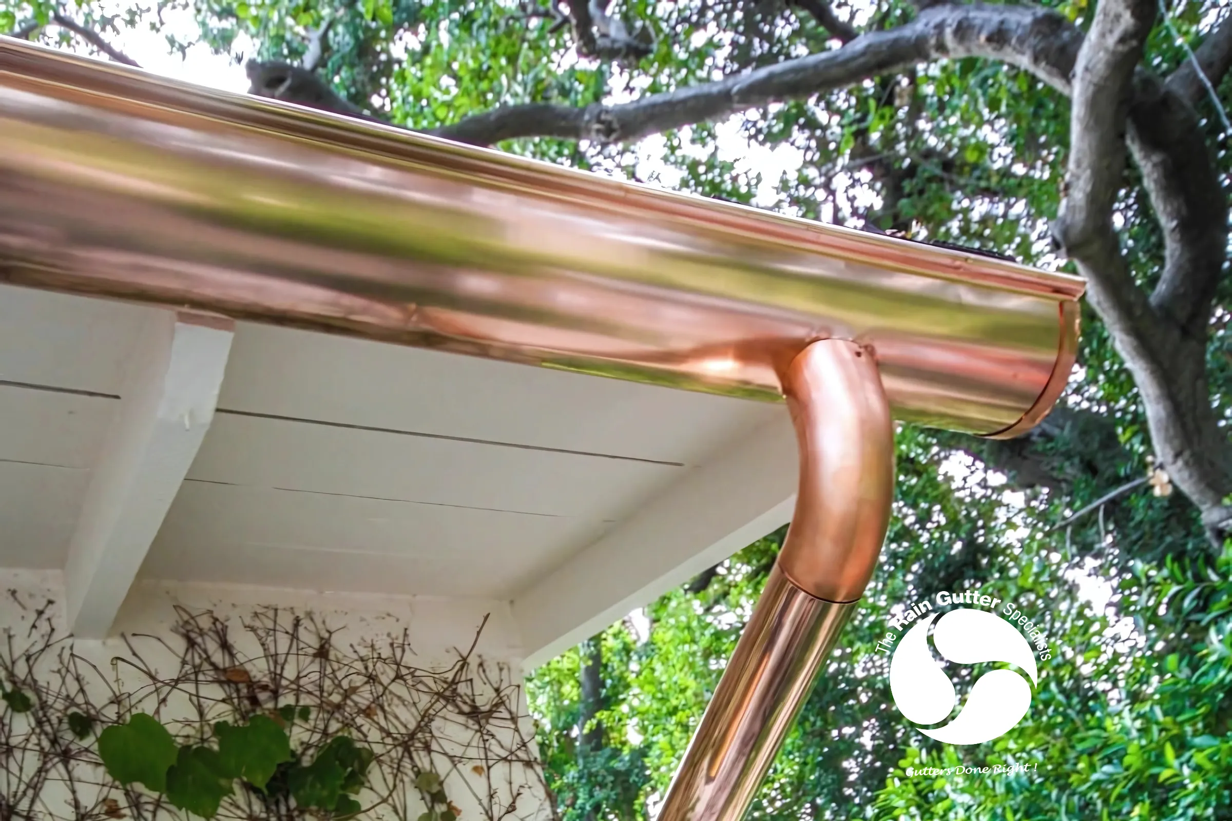 Detail of copper downspout connected to gutter