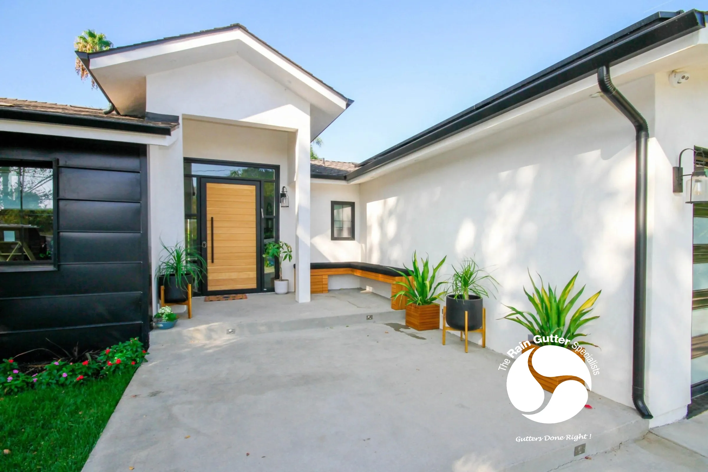 Black gutters on a modern home entrance